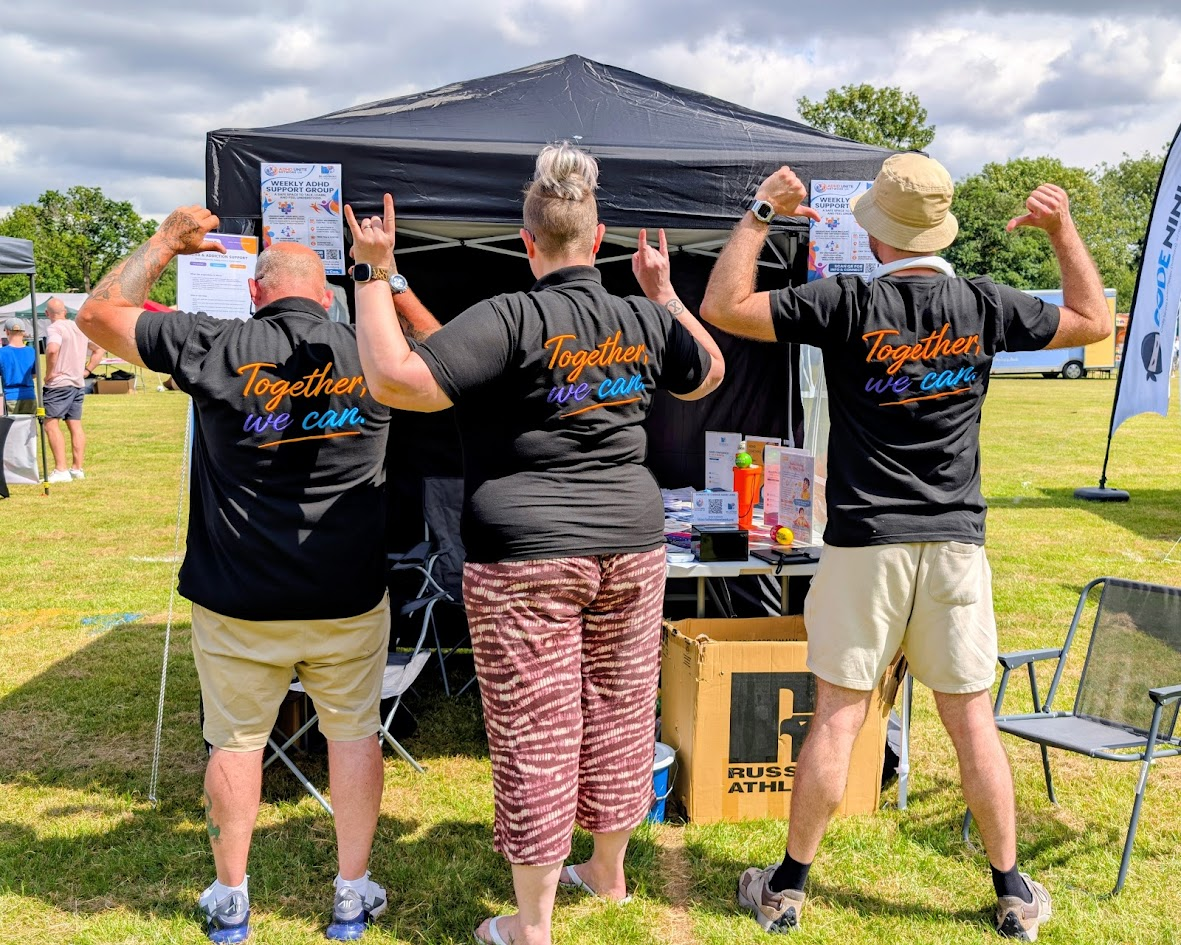 ADHD Unite Network UK team showing their 'Together we can' t-shirts at the Altrincham Festival stall