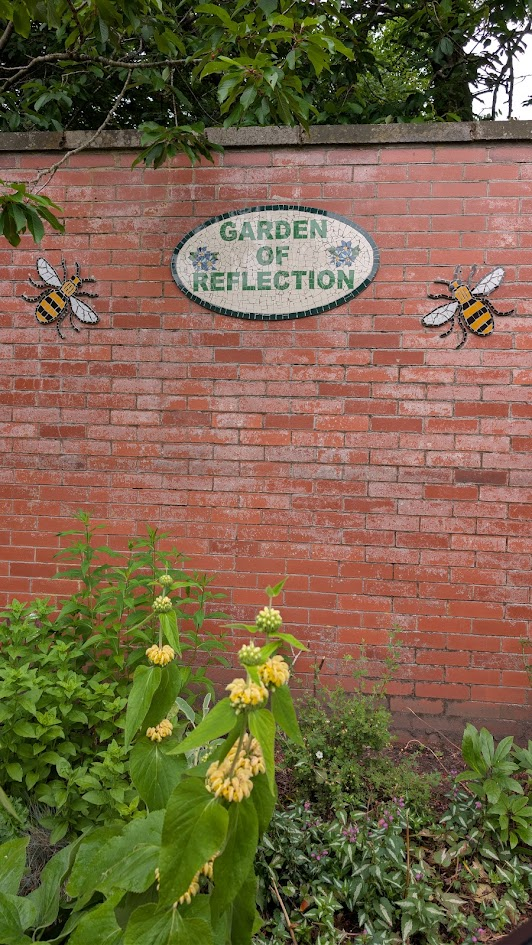 Garden of Reflection mosaic sign at Longford Park