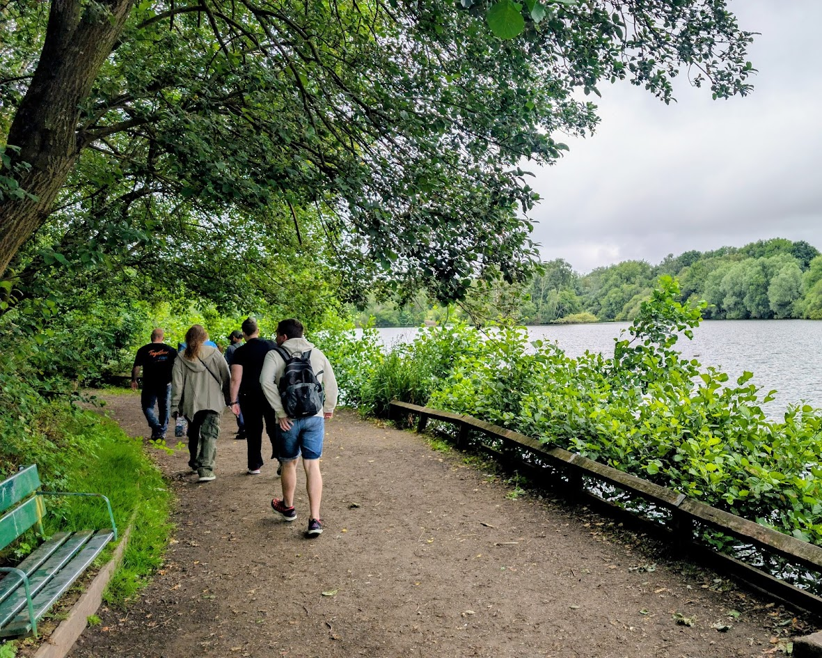 ADHD Unite group walking beside the lake at Chorlton Water Park