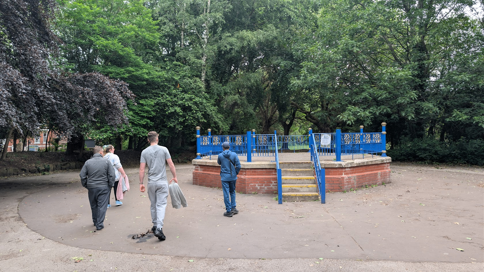 ADHD Unite group walking towards the blue bandstand at Worthington Park