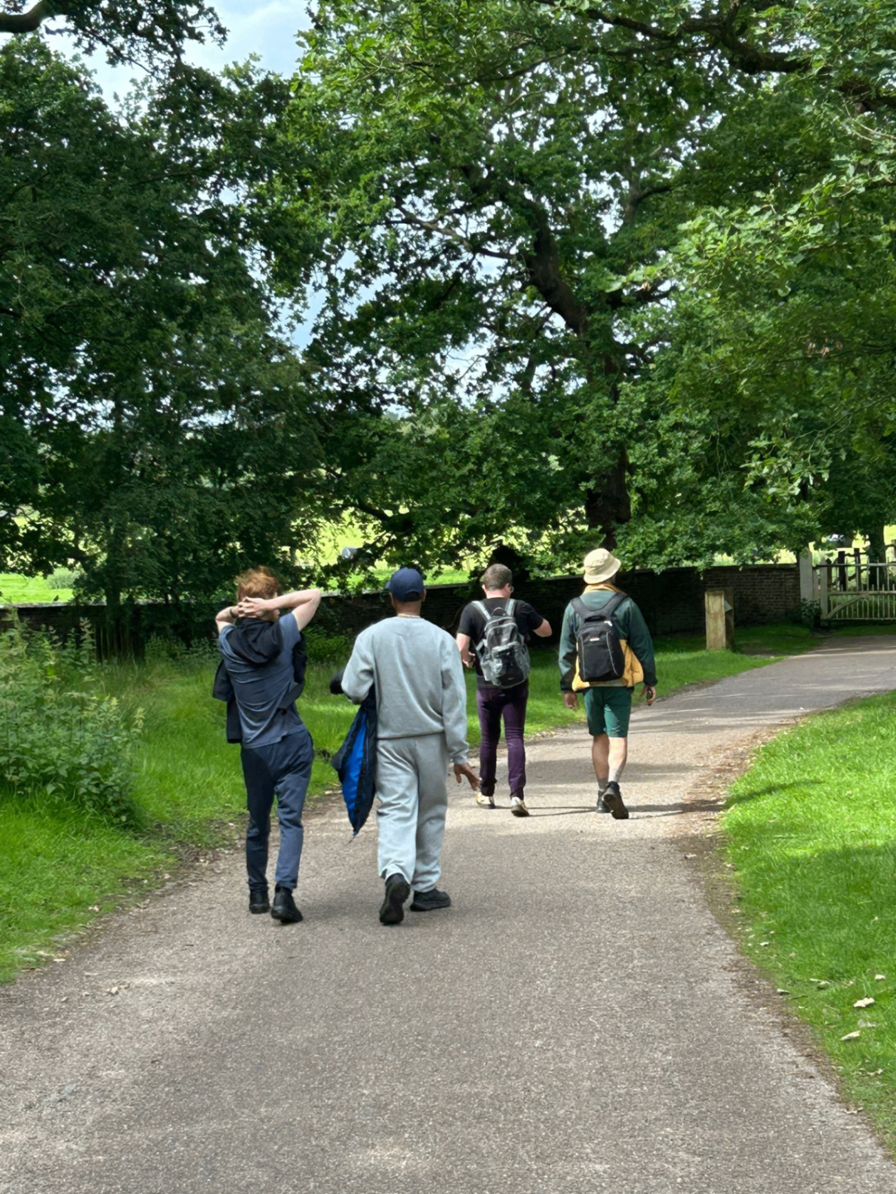 ADHD Unite group walking along a tree-lined path